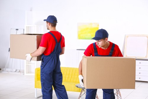 Professional piano removals team preparing an upright piano in Sweden