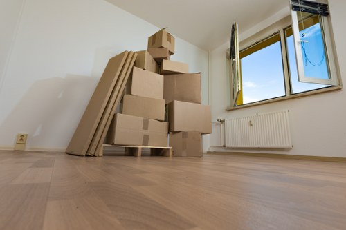 Movers packing boxes and furniture for a relocation in Sweden