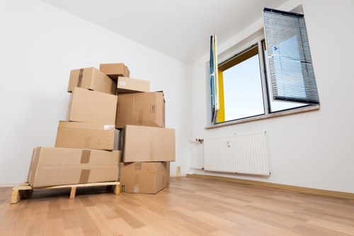 Trained movers using protective gloves and lifting techniques
