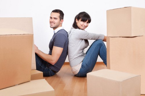 Furniture and boxes measured for cubic-yard removals pricing